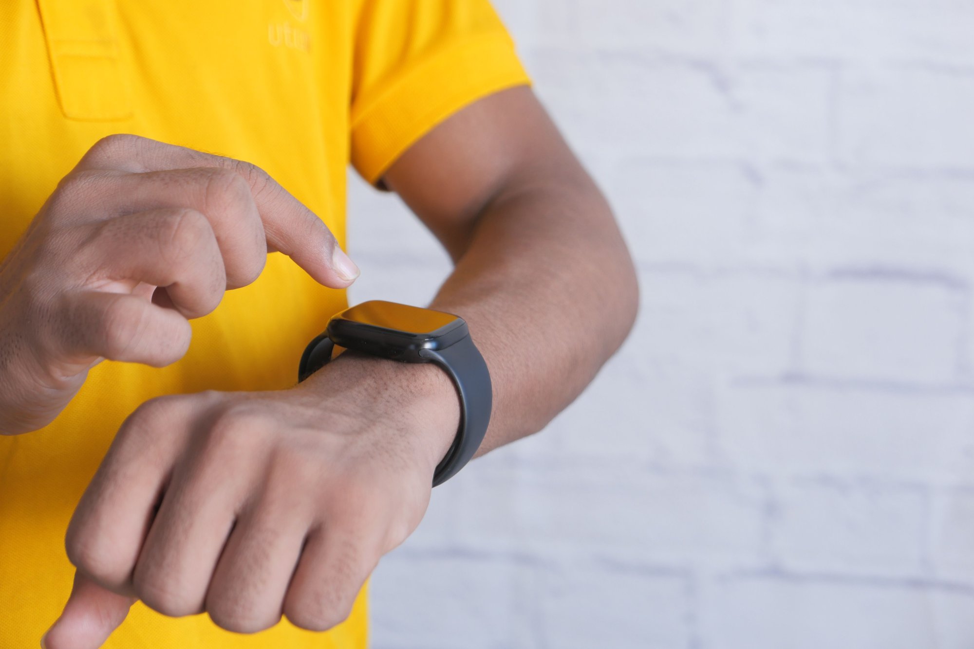 man checking his health statistics on his Apple watch