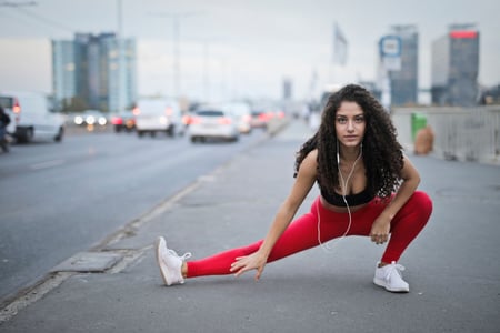 woman in activewear stretching after a good run